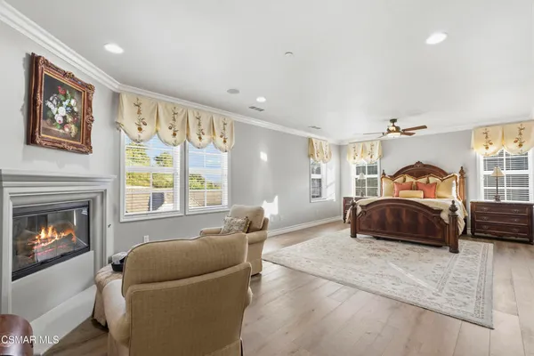 a bedroom with a bed and a couch