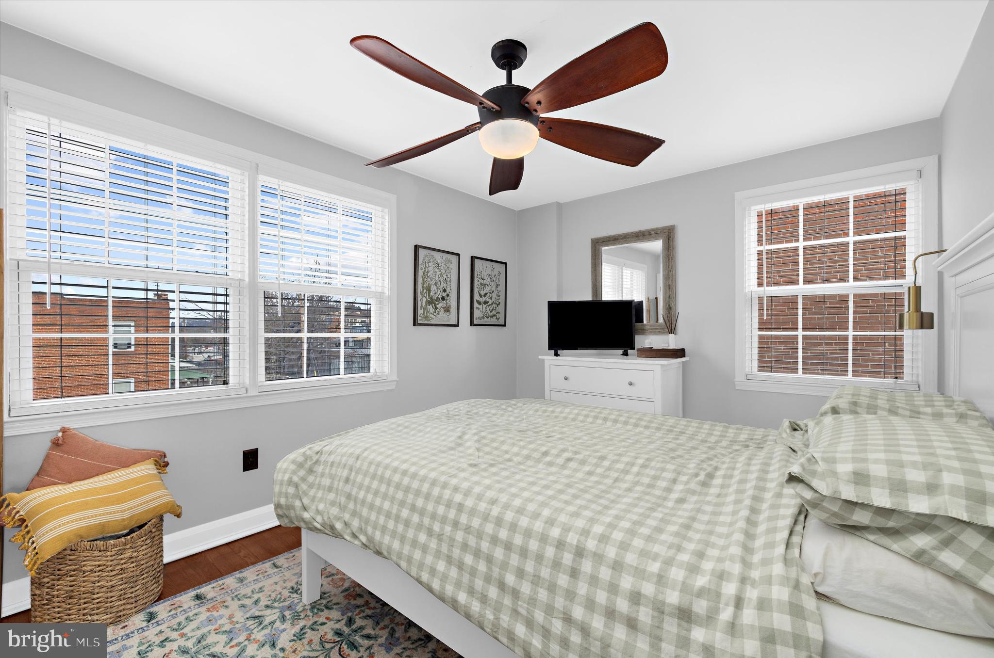 1215 Roland Heights Avenue Baltimore, MD 21211 - Photo 21 of 38 a bedroom with a bed and a flat screen tv