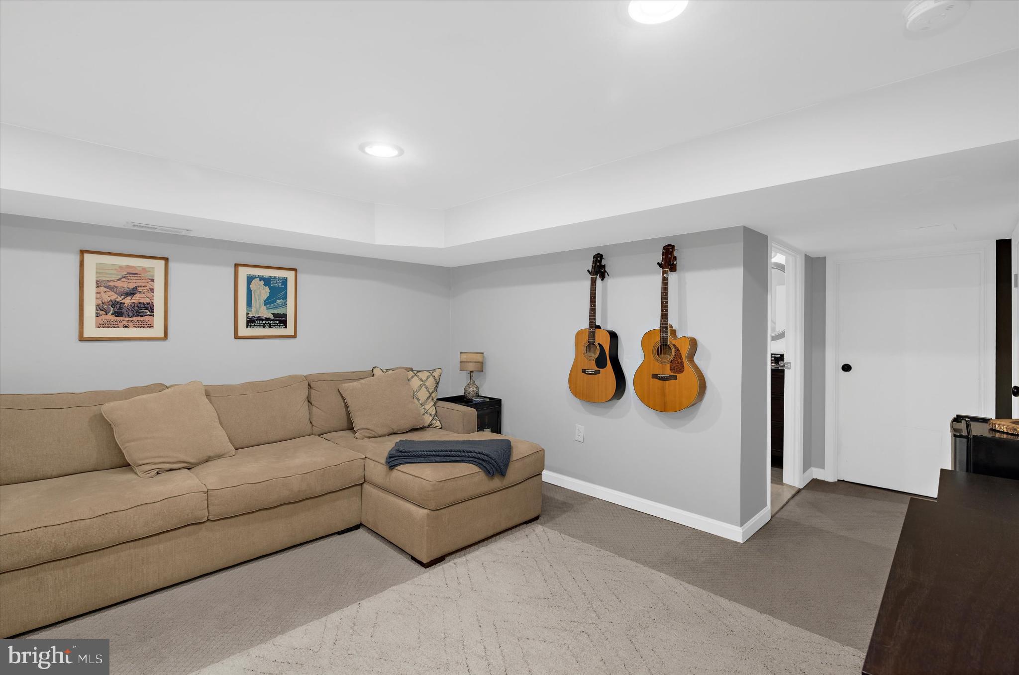 1215 Roland Heights Avenue Baltimore, MD 21211 - Photo 22 of 38 a living room with furniture and wall paintings