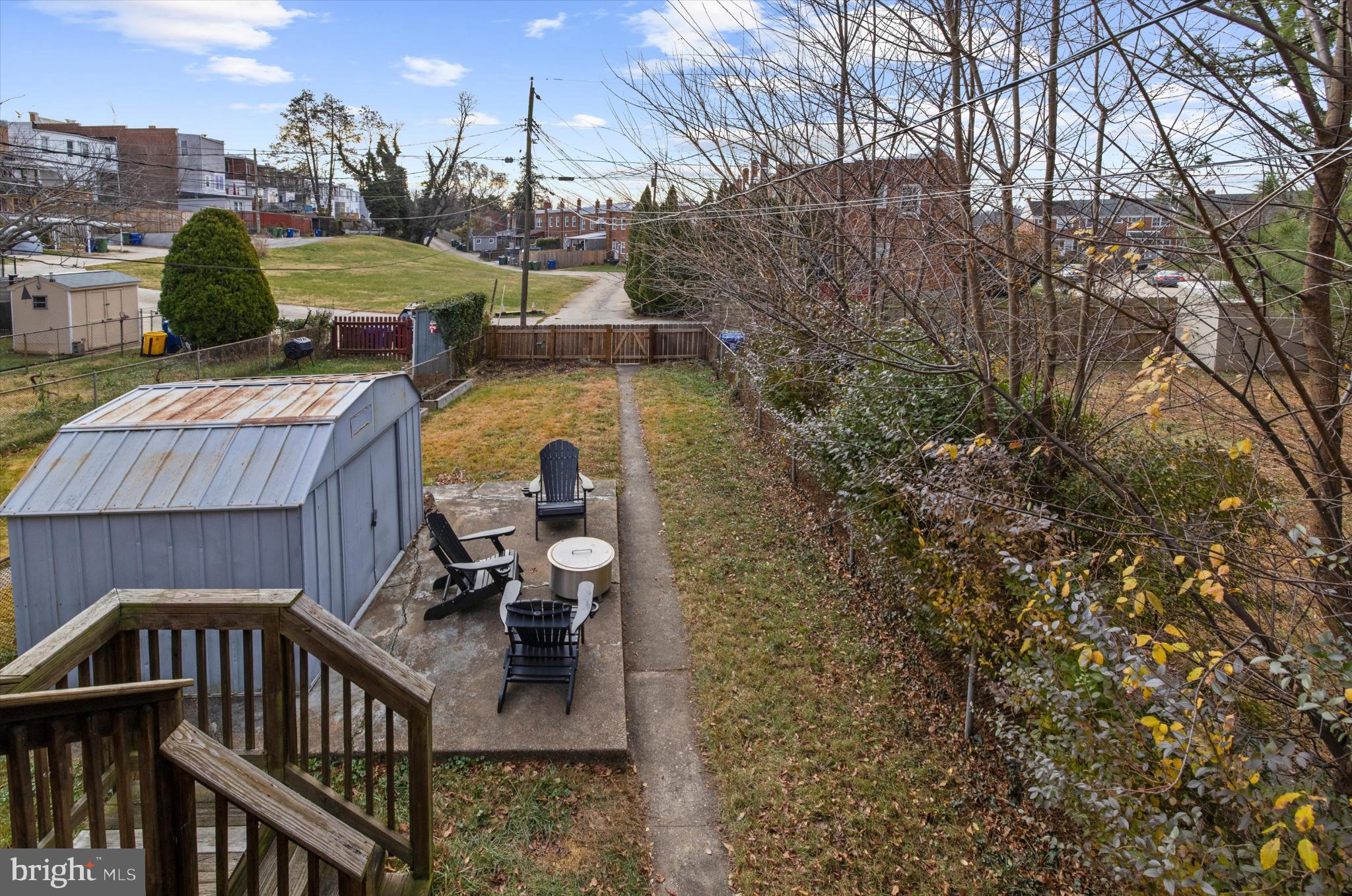 1215 Roland Heights Avenue Baltimore, MD 21211 - Photo 28 of 38 a view of a balcony with two chairs and a fire pit