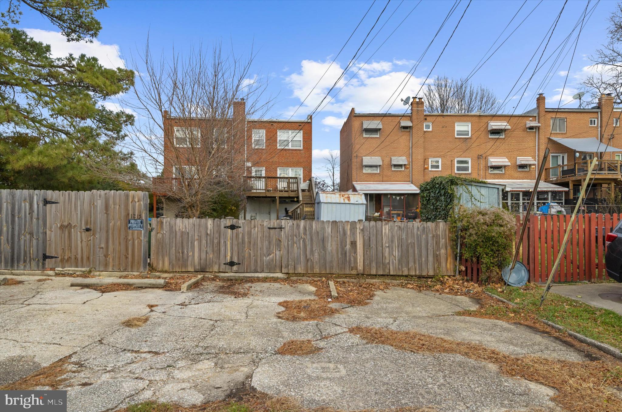 1215 Roland Heights Avenue Baltimore, MD 21211 - Photo 29 of 38 a front view of a house with a fence
