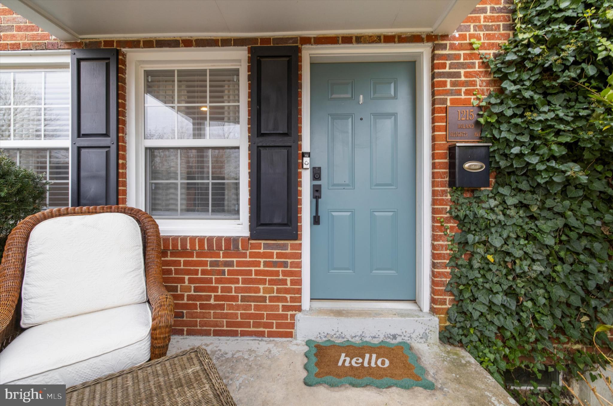 1215 Roland Heights Avenue Baltimore, MD 21211 - Photo 3 of 38 a view of front door of house and tree