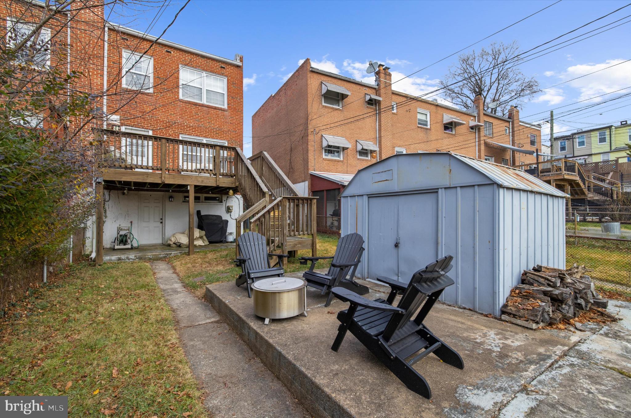 1215 Roland Heights Avenue Baltimore, MD 21211 - Photo 31 of 38 a view of a building with a table and chairs