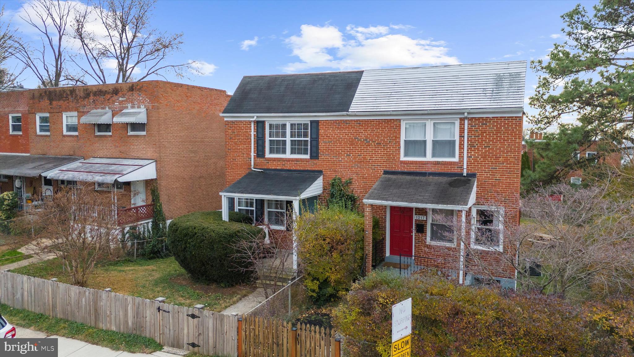 1215 Roland Heights Avenue Baltimore, MD 21211 - Photo 33 of 38 front view of a house with a yard