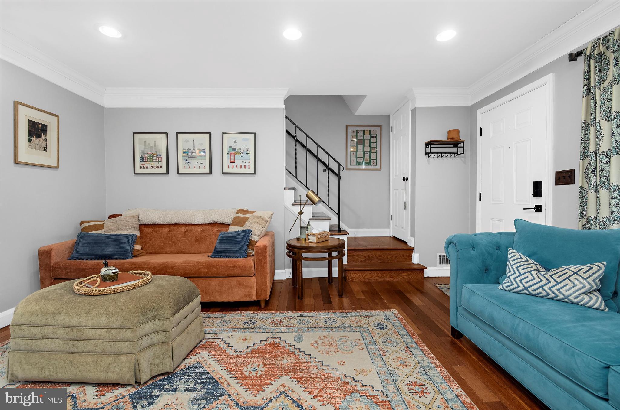 1215 Roland Heights Avenue Baltimore, MD 21211 - Photo 5 of 38 a living room with furniture and a rug