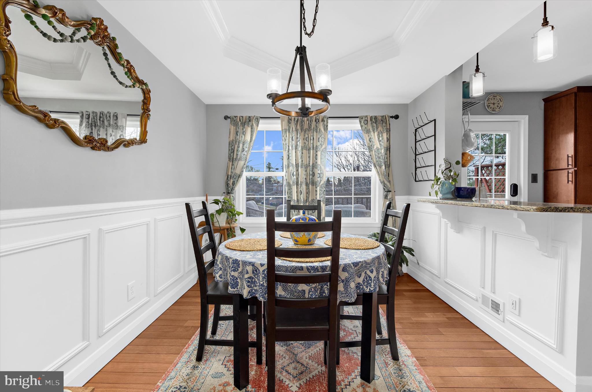 1215 Roland Heights Avenue Baltimore, MD 21211 - Photo 9 of 38 a view of a dining room with furniture wooden floor and chandelier