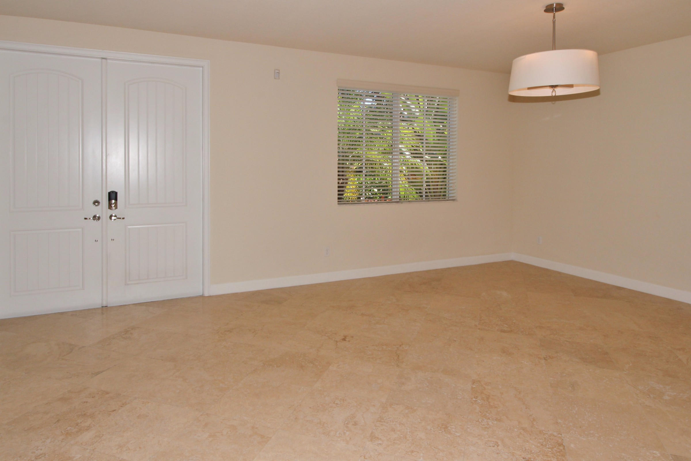 145 Northwest Emerson Place Boca Raton, FL 33432 - Photo 12 of 35 an empty room with a window