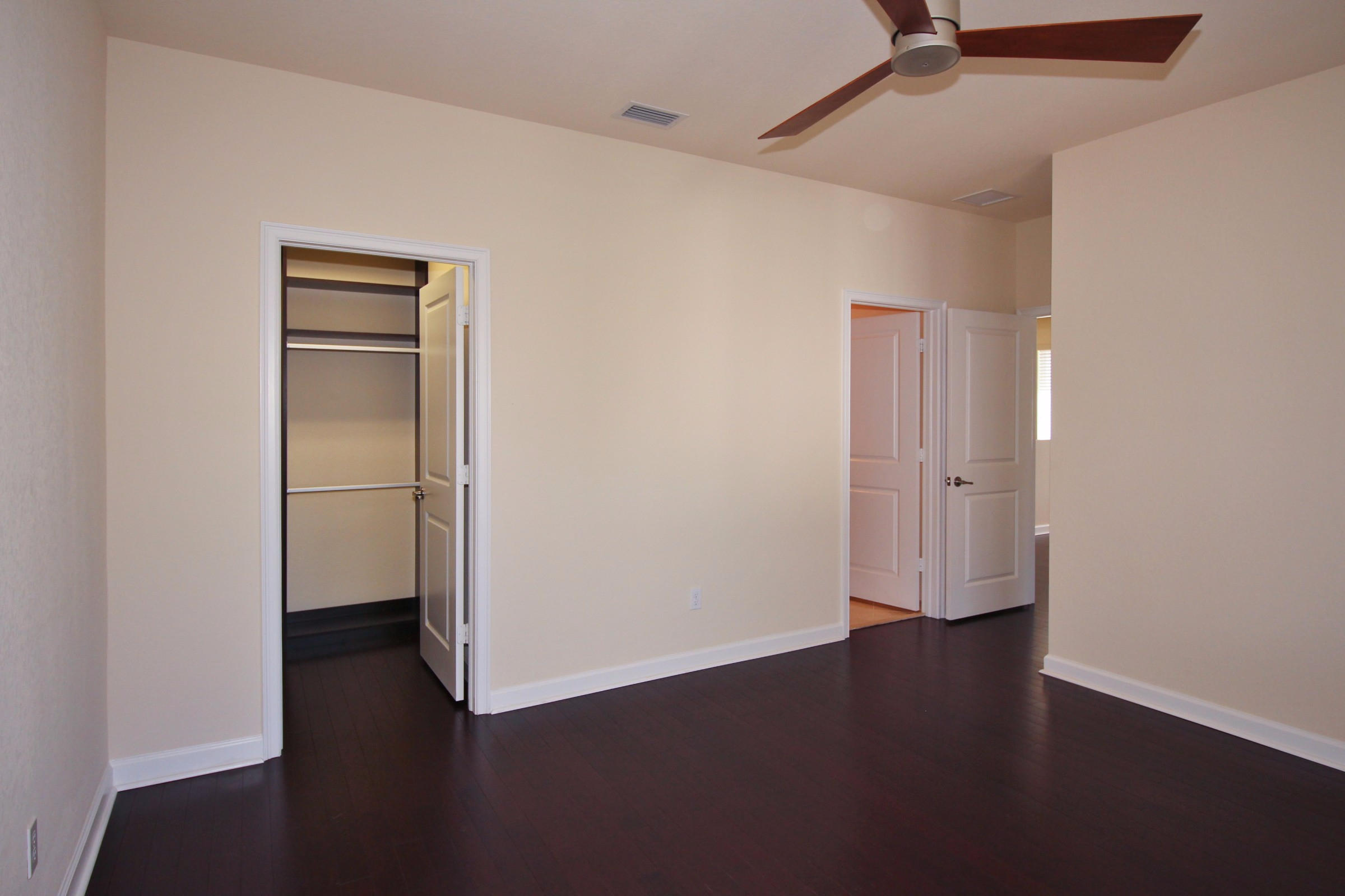 145 Northwest Emerson Place Boca Raton, FL 33432 - Photo 21 of 35 a view of an empty room with wooden floor
