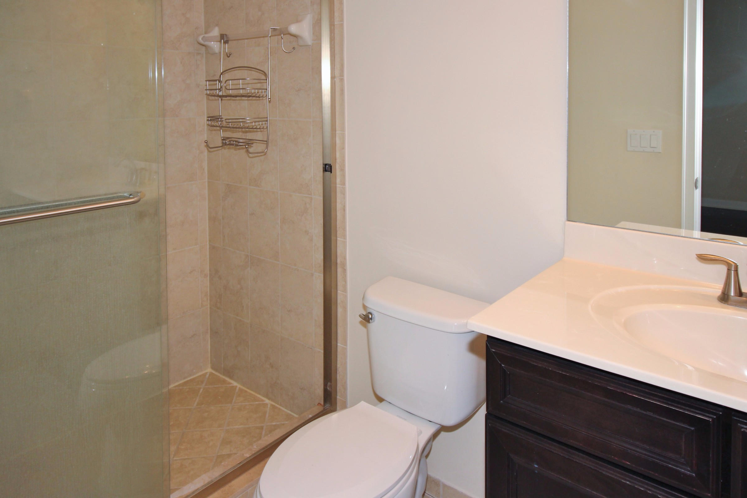 145 Northwest Emerson Place Boca Raton, FL 33432 - Photo 23 of 35 a bathroom with a granite countertop sink toilet and shower