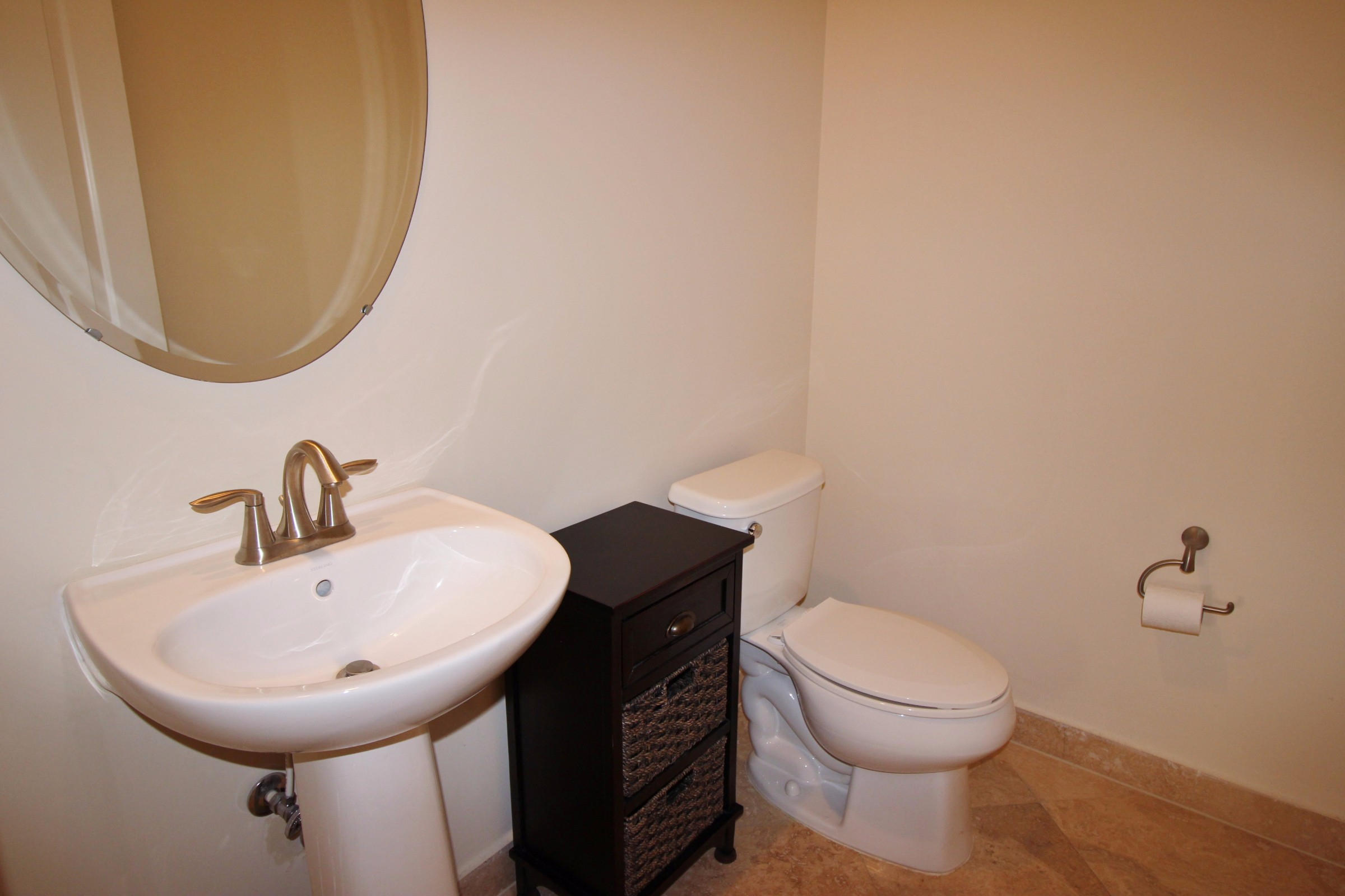 145 Northwest Emerson Place Boca Raton, FL 33432 - Photo 24 of 35 a bathroom with a sink and a mirror
