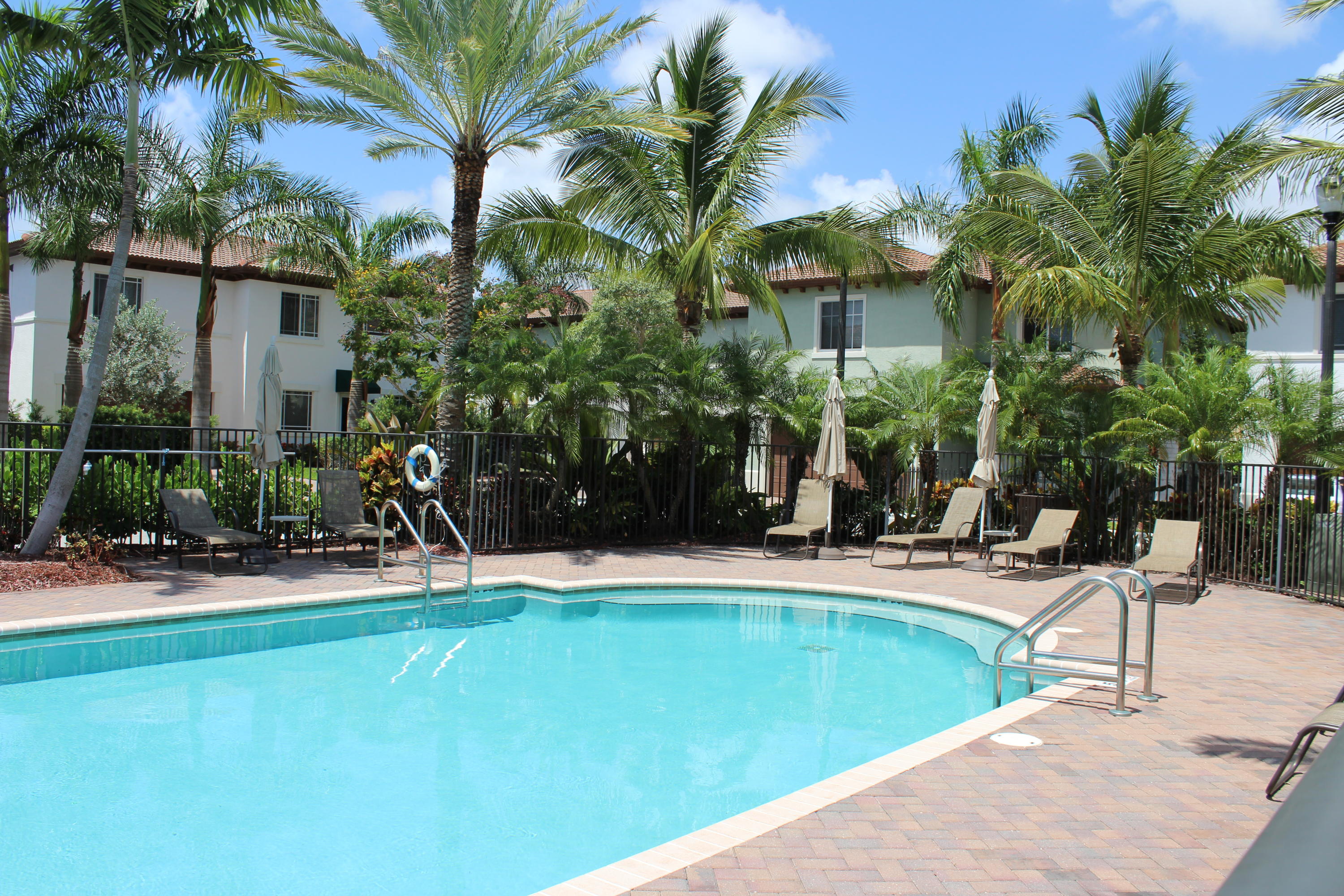 145 Northwest Emerson Place Boca Raton, FL 33432 - Photo 27 of 35 a view of a swimming pool with a patio