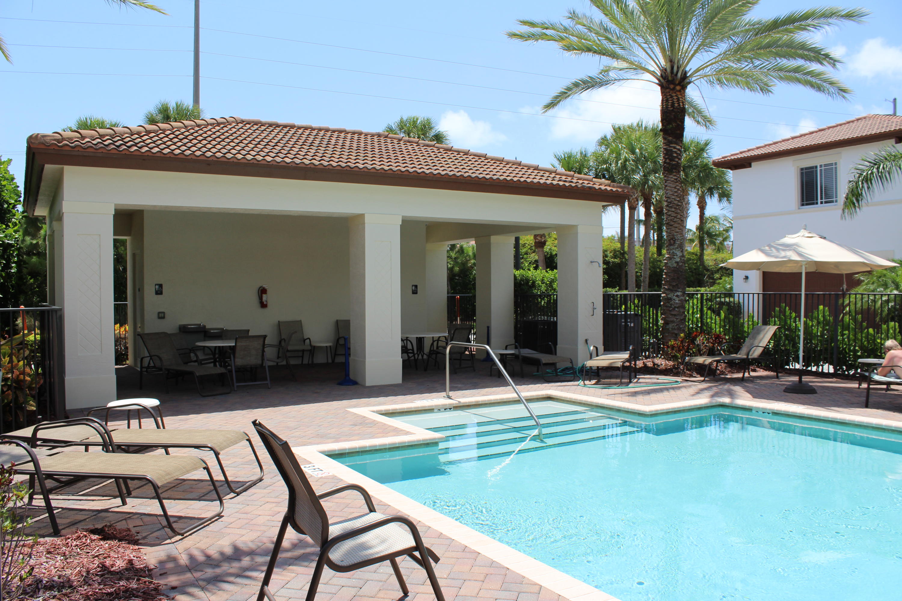 145 Northwest Emerson Place Boca Raton, FL 33432 - Photo 29 of 35 a view of a house with backyard porch and sitting area