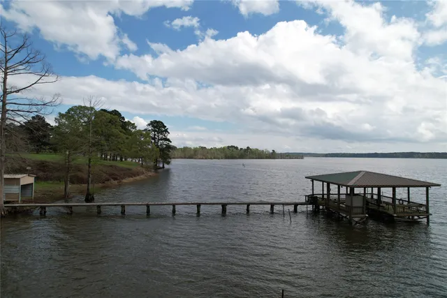 a view of a swimming pool with outdoor seating