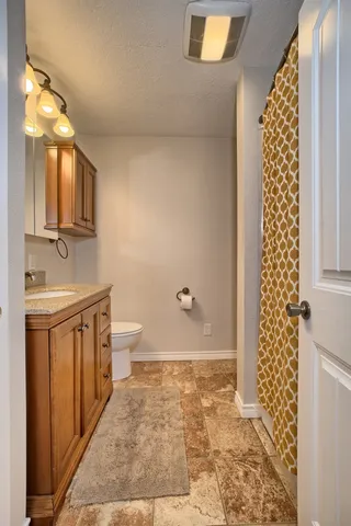 a dining room with stainless steel appliances granite countertop furniture wooden floor and a view of kitchen