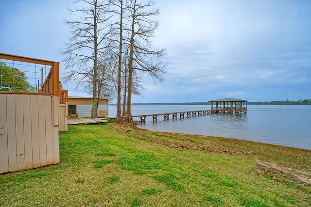 a balcony with table and chairs