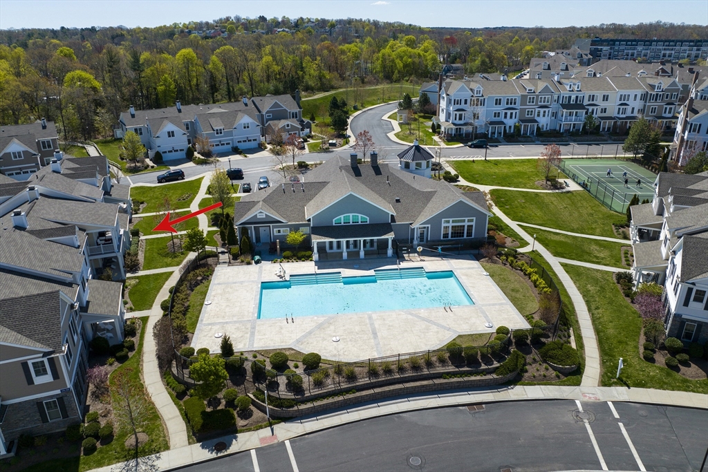an aerial view of a house with swimming pool patio and mountain view