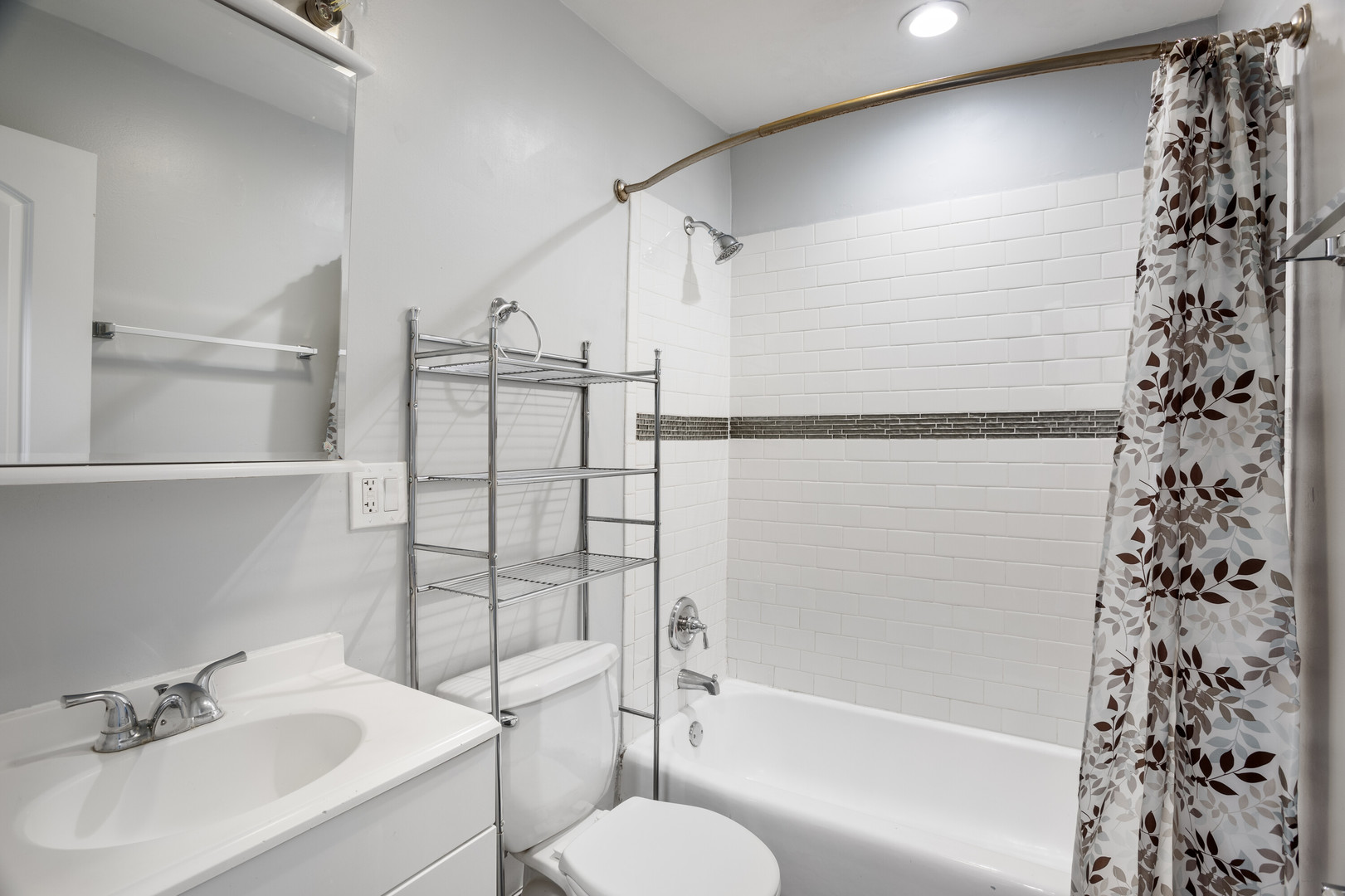 6826 North Ridge Boulevard, Unit 401 Chicago, IL 60645 - Photo 11 of 16 a bathroom with a shower and a sink