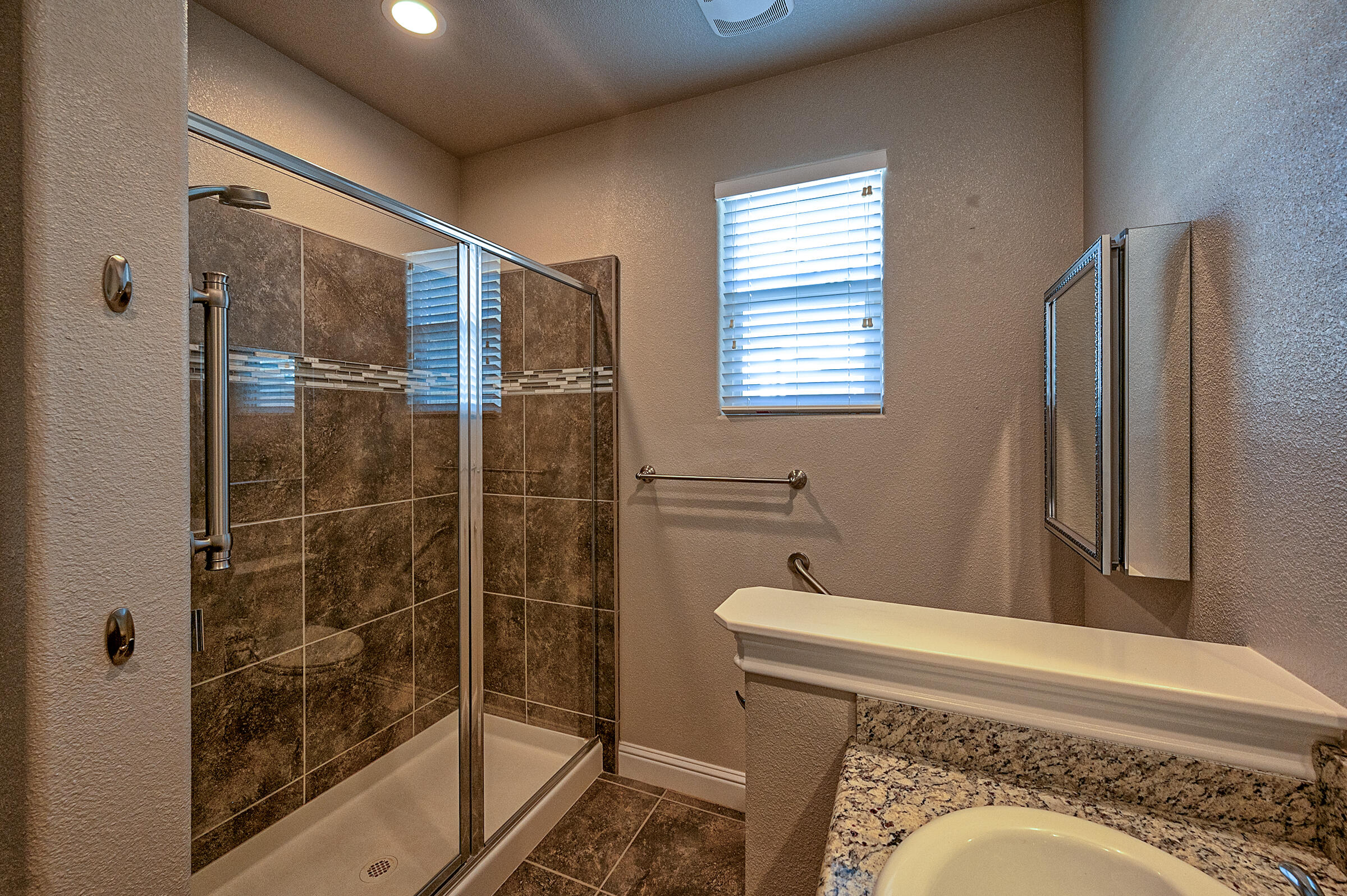 3375 Hotlam Road Redding, CA 96002 - Photo 16 of 38 a bathroom with a sink and a mirror