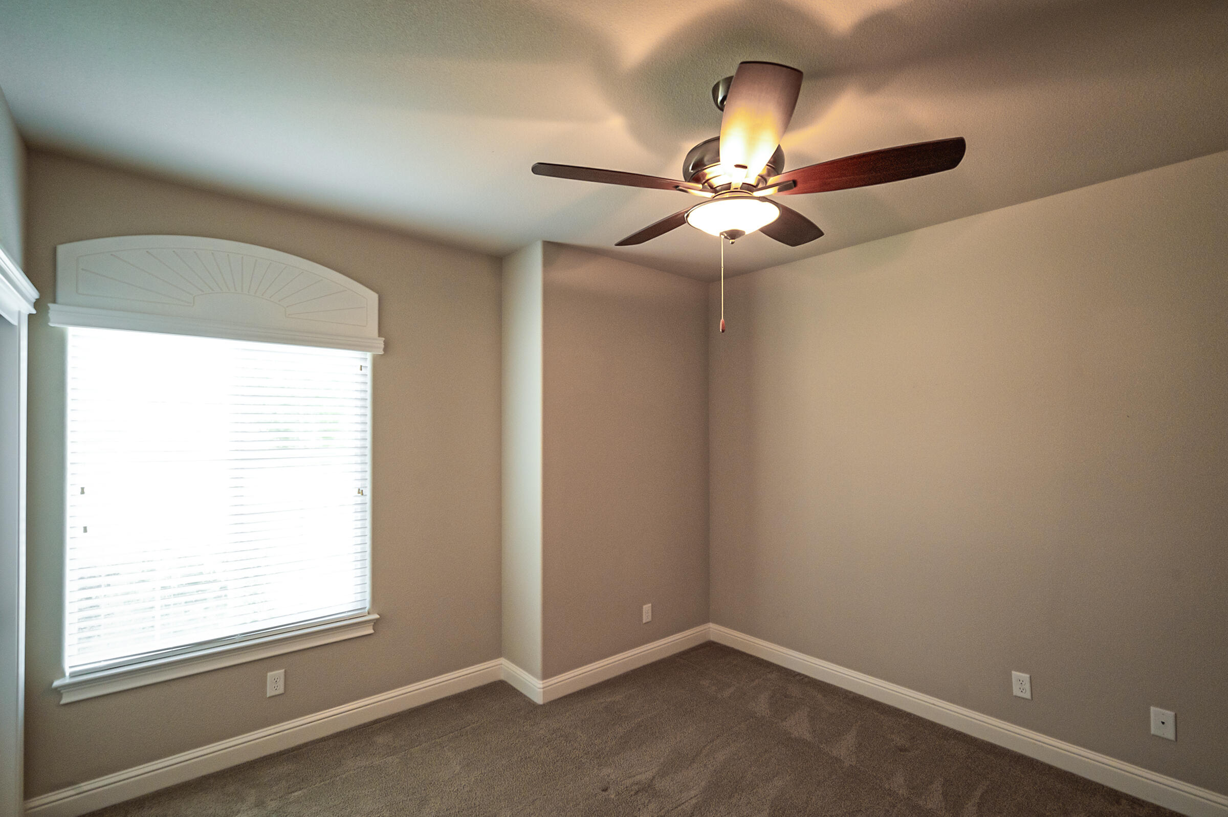 3375 Hotlam Road Redding, CA 96002 - Photo 26 of 38 an empty room with a window and a fan