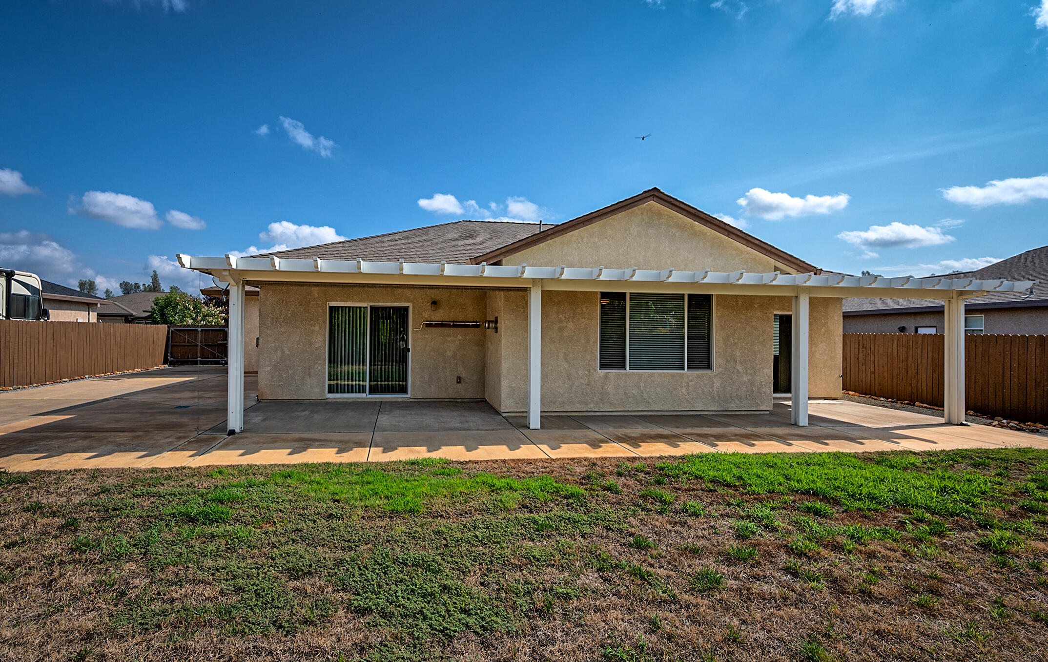 3375 Hotlam Road Redding, CA 96002 - Photo 32 of 38 a front view of a house with a garden and yard