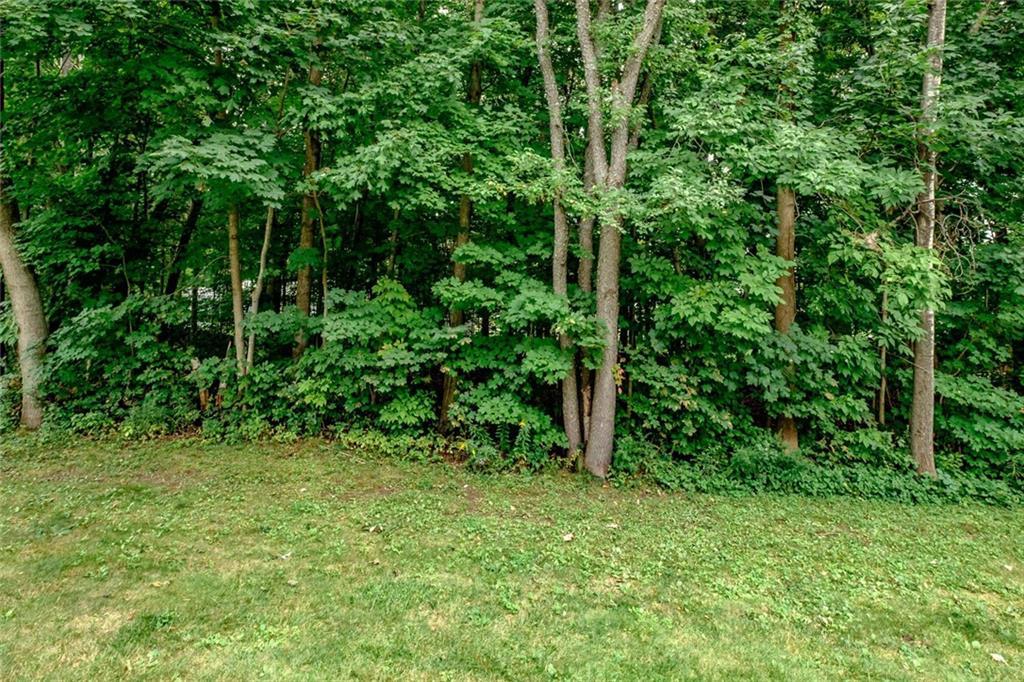 17 Graham Road, Unit 23 Westbrook, ME 04092 - Photo 28 of 28 The condo looks over a wooden area...