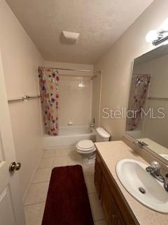 1527 Northeast 40th Place Gainesville, FL 32609 - Photo 12 of 19 a bathroom with a double vanity sink toilet and shower