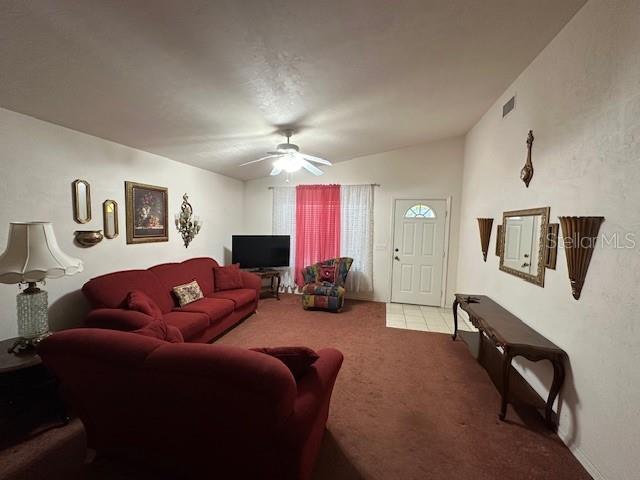 1527 Northeast 40th Place Gainesville, FL 32609 - Photo 4 of 19 a living room with furniture ceiling fan and a window