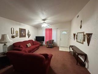 1527 Northeast 40th Place Gainesville, FL 32609 - Photo 5 of 19 a living room with furniture a couch and dresser