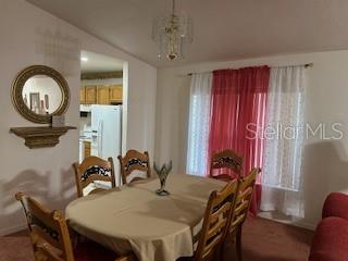 1527 Northeast 40th Place Gainesville, FL 32609 - Photo 6 of 19 a view of a dining room with furniture