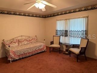 1527 Northeast 40th Place Gainesville, FL 32609 - Photo 7 of 19 a spacious bedroom with a bed and a chandelier