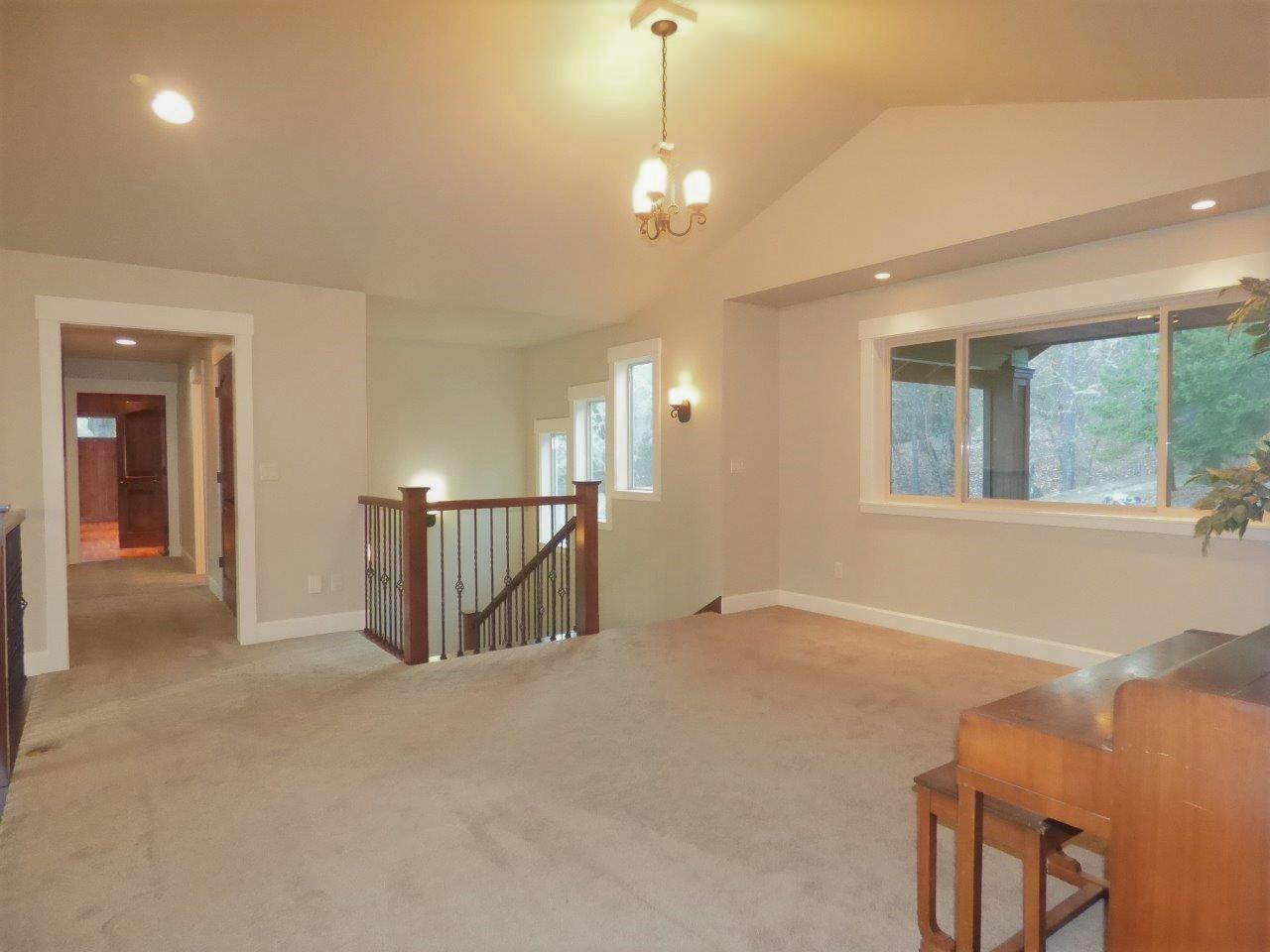 2144 Southwest Allen Creek Road Grants Pass, OR 97527 - Photo 27 of 55 Upstairs bonus area has plenty of room for hobbies and fun. It is a loft-like area open to the downstairs great area, so it would be ideal for music entertaining, if desired.