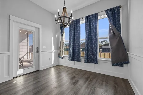 a bedroom with a large bed and a ceiling fan