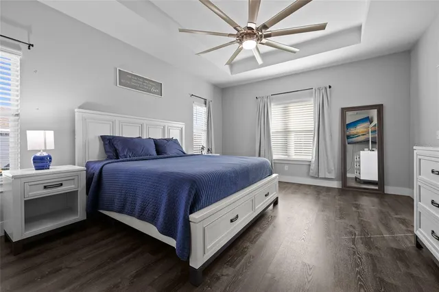 a bedroom with a bed and a tv