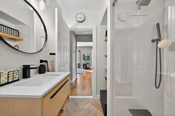 a bathroom with a sink and a mirror