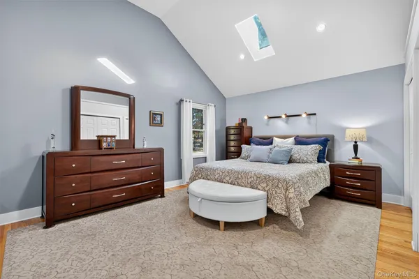 a bedroom with a bed and a night stand