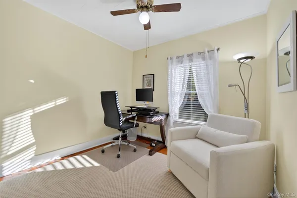 a work room with furniture and windows