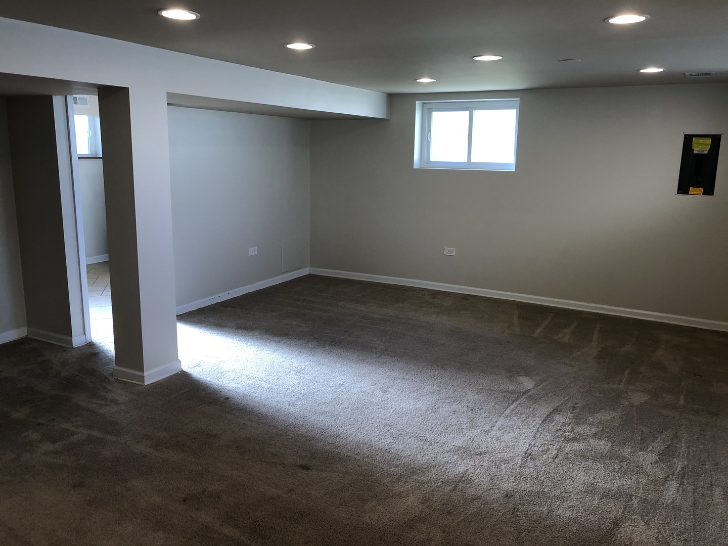 1674 Maple Street Des Plaines, IL 60018 - Photo 12 of 28 an empty room with wooden floor and windows