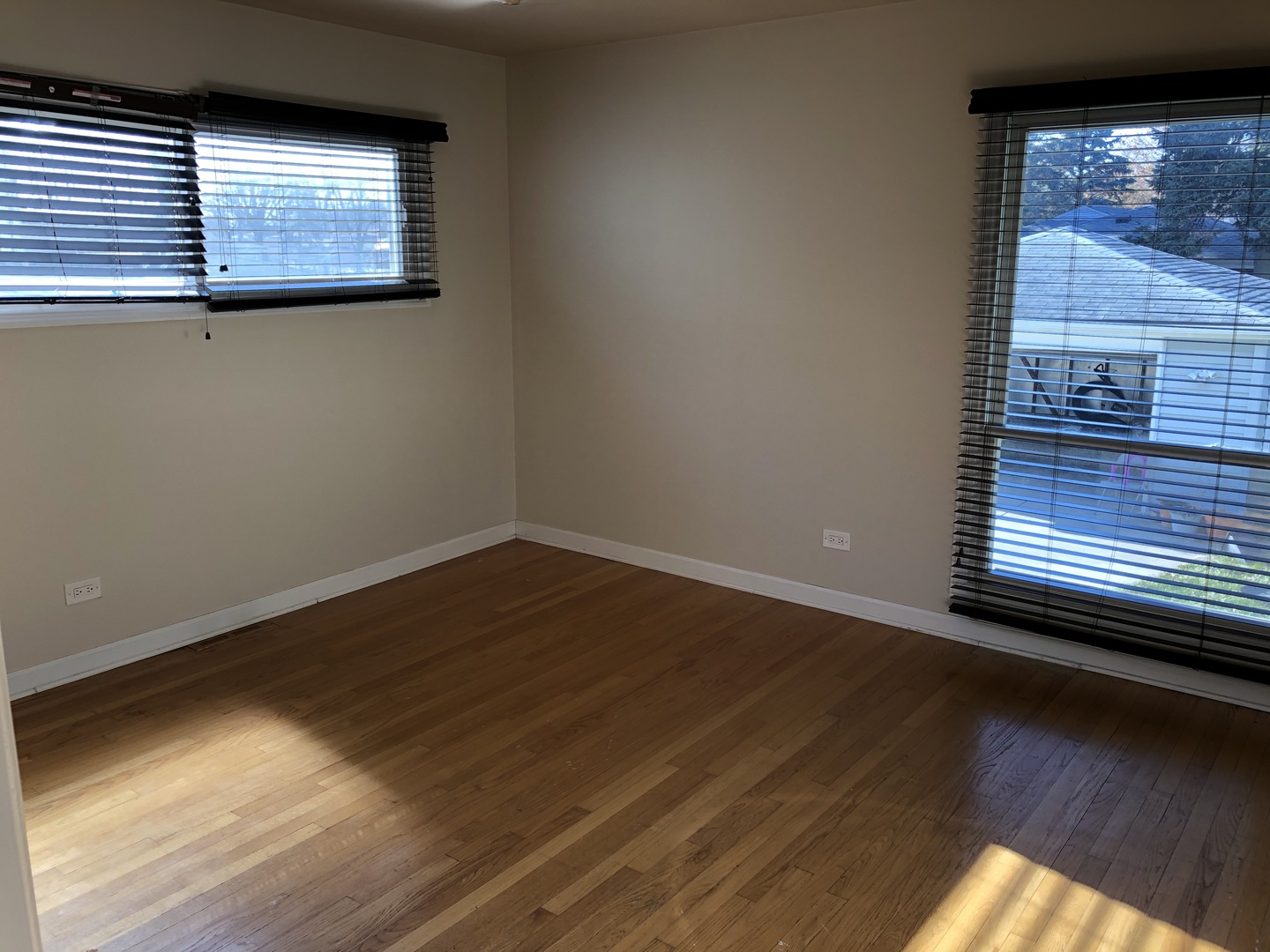 1674 Maple Street Des Plaines, IL 60018 - Photo 20 of 28 a view of a room with wooden floors and a window