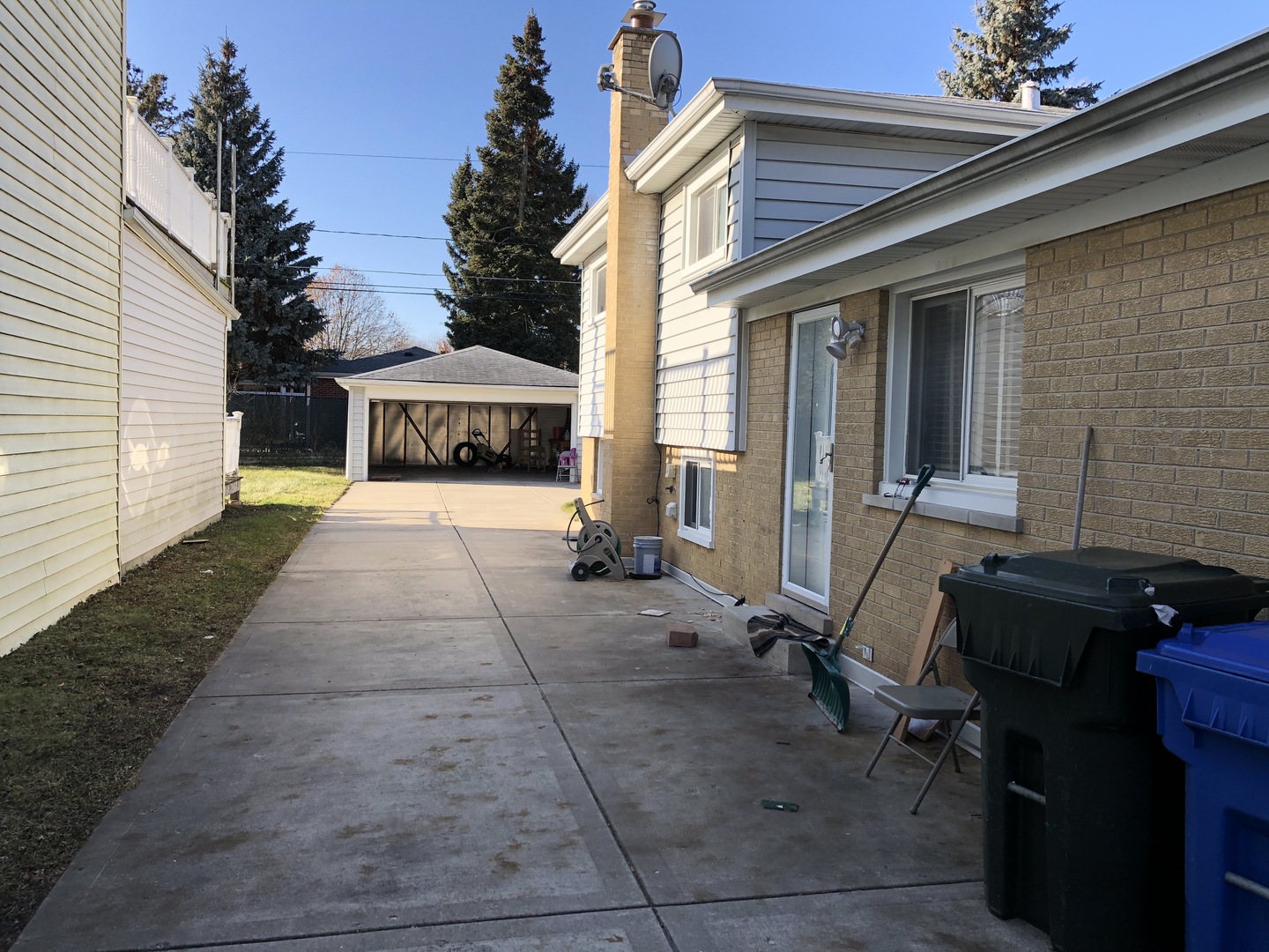 1674 Maple Street Des Plaines, IL 60018 - Photo 2 of 28 a view of a patio with a table and chairs under an umbrella