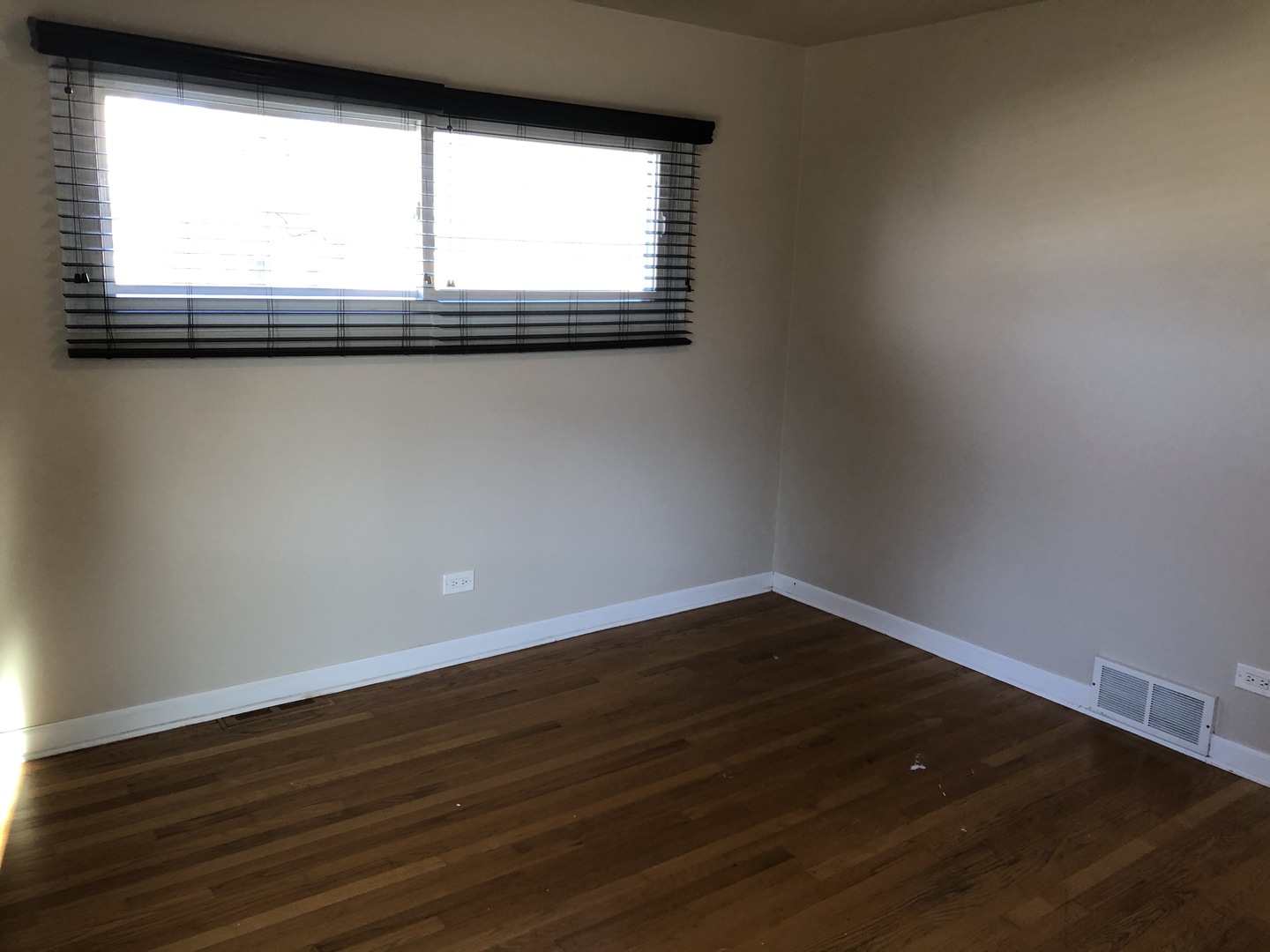 1674 Maple Street Des Plaines, IL 60018 - Photo 21 of 28 a view of empty room with wooden floor and fan