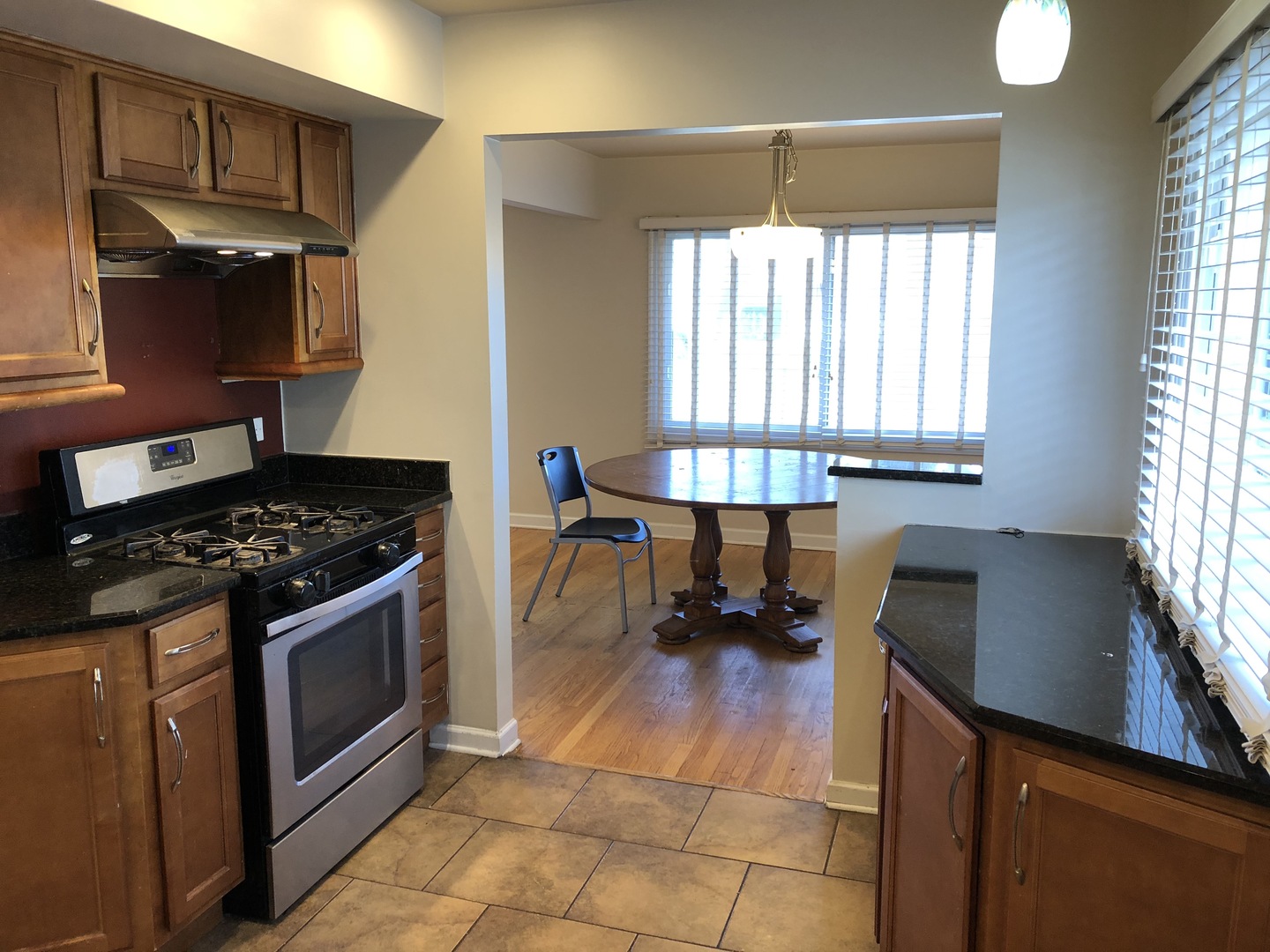 1674 Maple Street Des Plaines, IL 60018 - Photo 5 of 28 a kitchen with a stove a sink and a cabinets