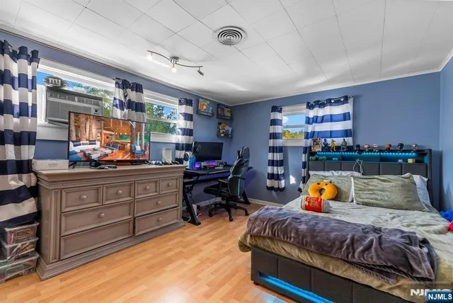 a bedroom with a bed and a desk