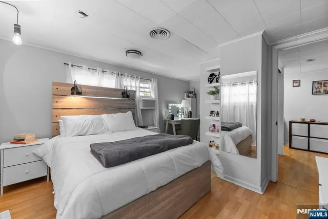 a bedroom with a bed and a couch