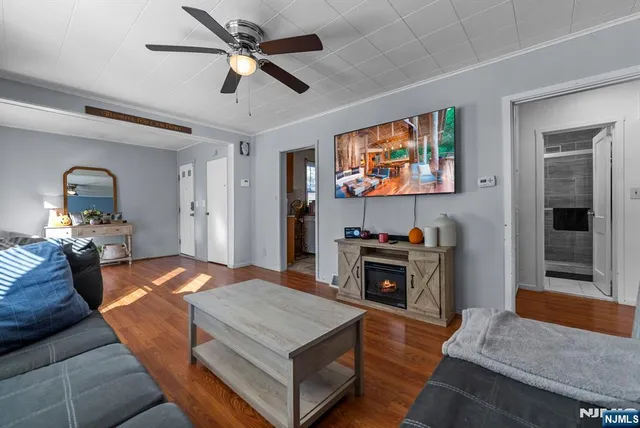 a room with furniture and a flat screen tv