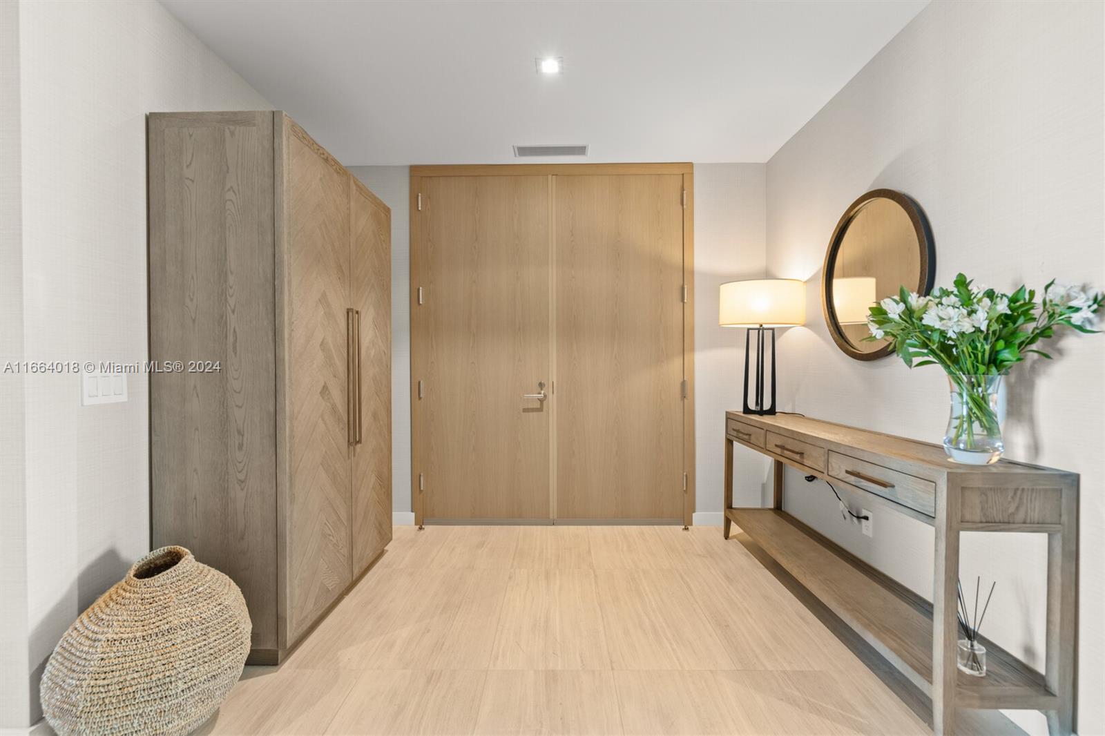 18975 Collins Avenue, Unit 5002 Sunny Isles Beach, FL 33160 - Photo 12 of 37 a bedroom with a bed and a potted plant