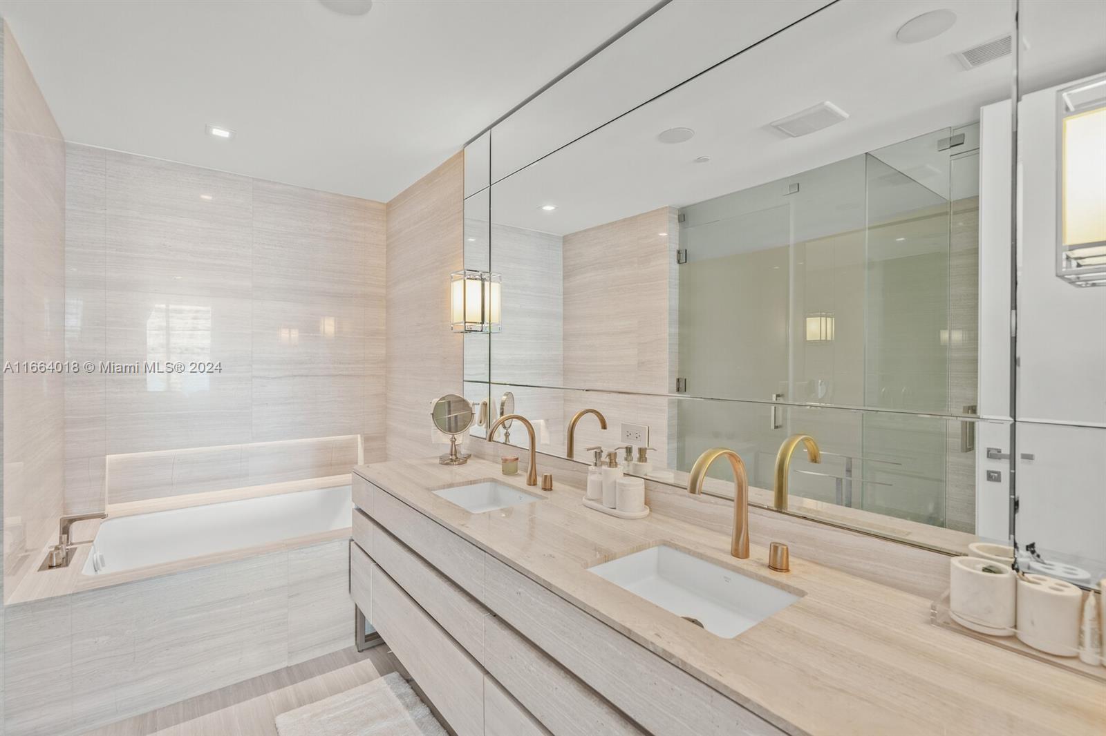 18975 Collins Avenue, Unit 5002 Sunny Isles Beach, FL 33160 - Photo 16 of 37 a bathroom with a double vanity sink mirror and double