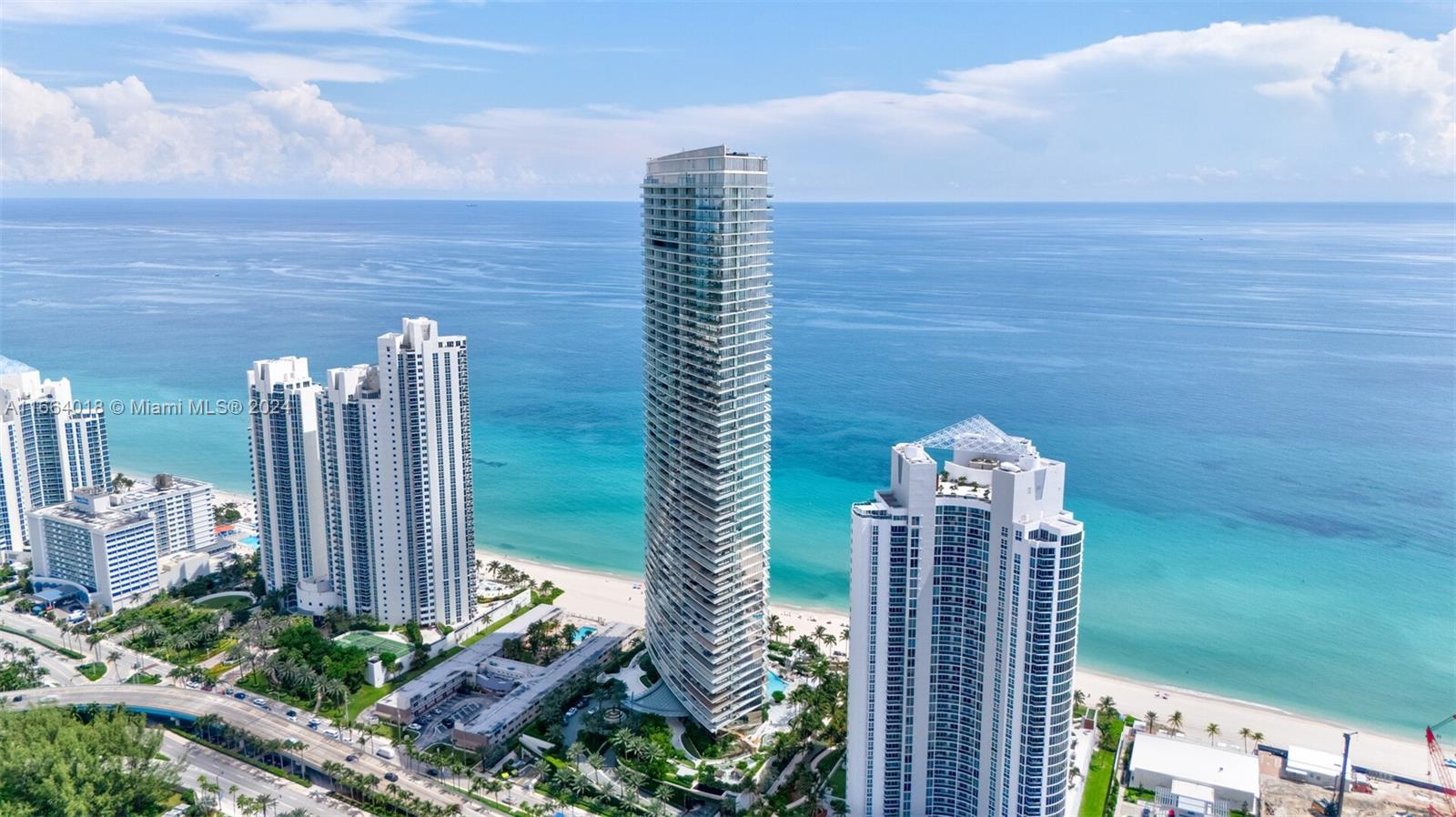 18975 Collins Avenue, Unit 5002 Sunny Isles Beach, FL 33160 - Photo 36 of 37 a green field with lots of plants and trees in the background