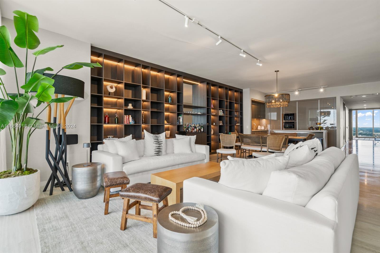 18975 Collins Avenue, Unit 5002 Sunny Isles Beach, FL 33160 - Photo 5 of 37 a living room with furniture and a floor to ceiling window