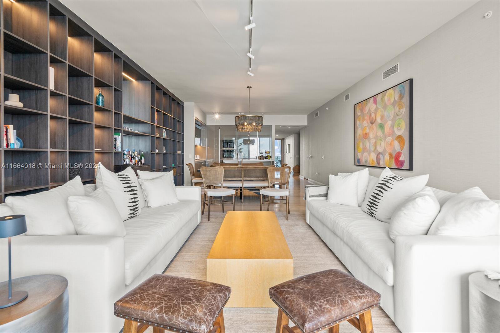 18975 Collins Avenue, Unit 5002 Sunny Isles Beach, FL 33160 - Photo 8 of 37 a living room with furniture and a large window