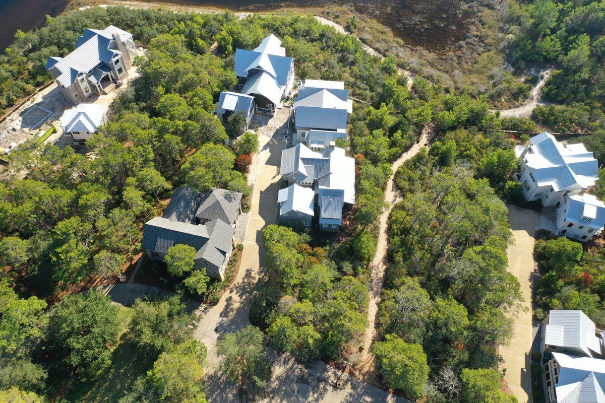 Lot 6 Cedar Fork Road Santa Rosa Beach, FL 32459 - Photo 8 of 18 an aerial view of a house with a yard and garden
